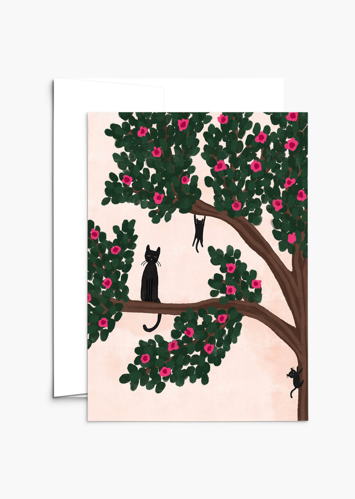 A Cats in the tree - Mother's Day card from Mimi & August, featuring an illustration of a tree with pink flowers and green leaves, where three silhouetted cats are perched on its branches, perfect for the cat-loving mom.
