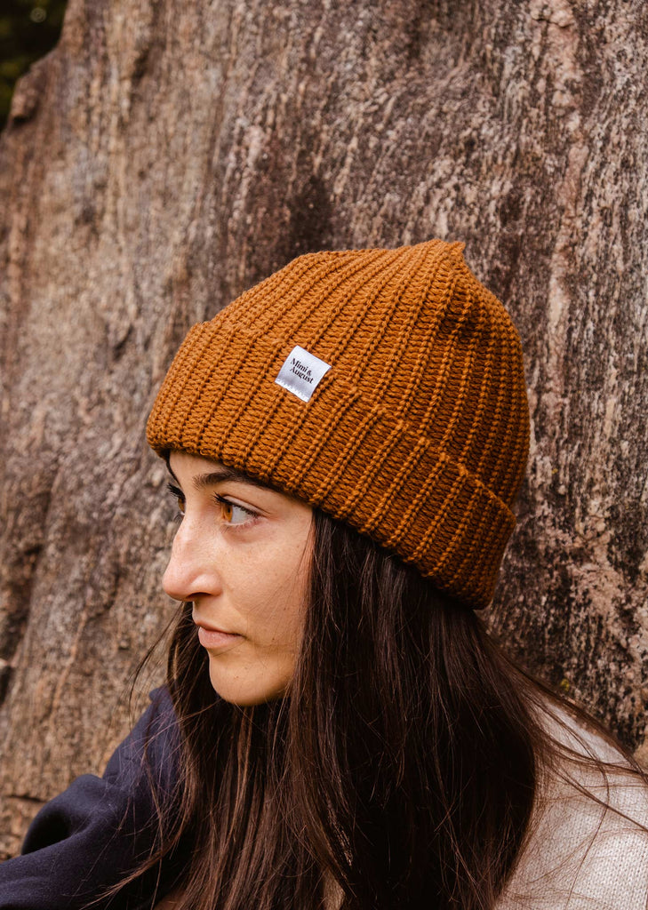 Model wearing the Chestnut Chunky Beanie in the forest