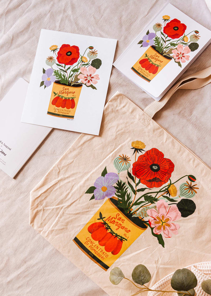 A san marzano tote bag with flowers and a art print from mimi and august.