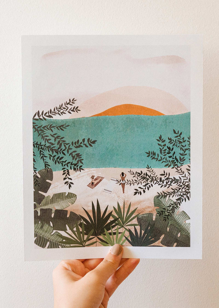 A hand holding up the El mar art print by mimi and august.