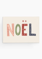 The Enchanted Christmas greeting card from Mimi & August features the text "Noël" in decorative red, green, and blue letters on a plain background, making it ideal for Christmas cards crafted on recycled paper.