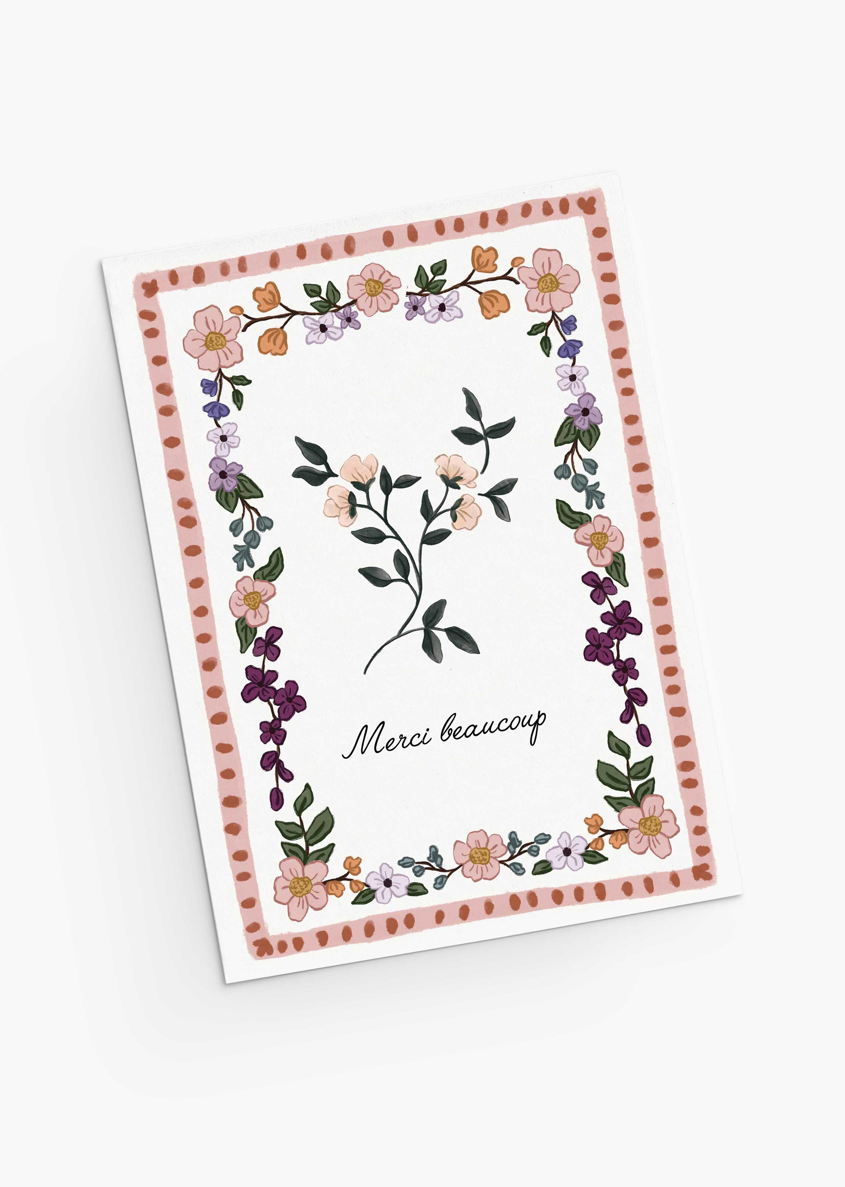 The Floral Thank You Greeting Card by Mimi & August features a vintage flower design with a delicate border and "Merci beaucoup" in cursive on recycled paper—perfect for expressing gratitude.