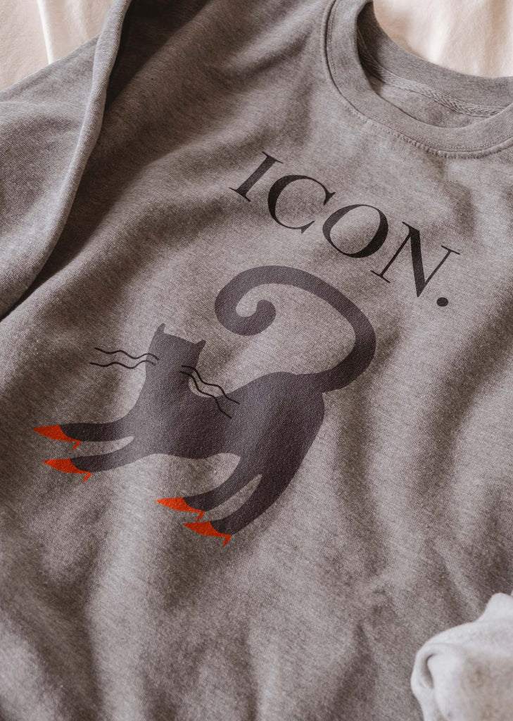 A comfortable Icon Sweatshirt with a black cat icon from Mimi & August.
