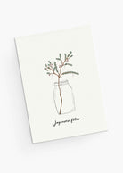 The Mimi & August Christmas Tree Branch Greeting Card features a festive branch in a glass jar and “Joyeuses fêtes” text, is blank inside for your message, and printed on recycled paper.