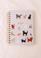 The Kittens - Agenda 2025 by Mimi & August showcases a spiral binding and adorable illustrations of colorful cats on its sturdy cover, along with monthly tabs for effortless navigation.