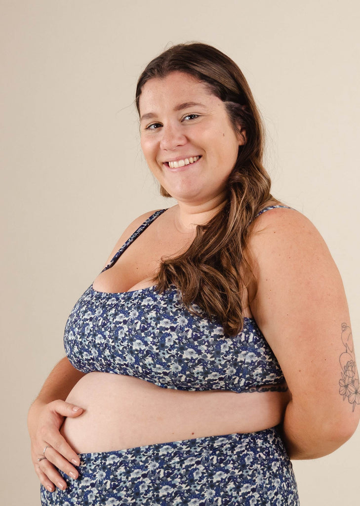 A beautiful pregnant woman in a Lima Moonflower Bralette Bikini Top.