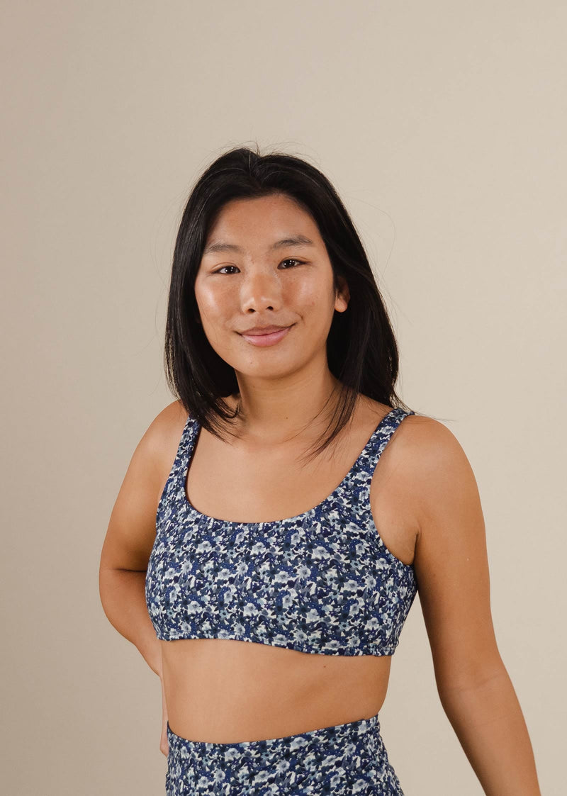 A woman in a mimi and august Lima Moonflower Bralette Bikini Top posing for a picture.