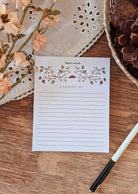 The Mimi & August Free Note Pad (100% off) with floral design, labeled "A FAIRE | TO DO," is ideal for jotting tasks or planning your Free Gift BOGO Bundle—features a charming lined layout.
