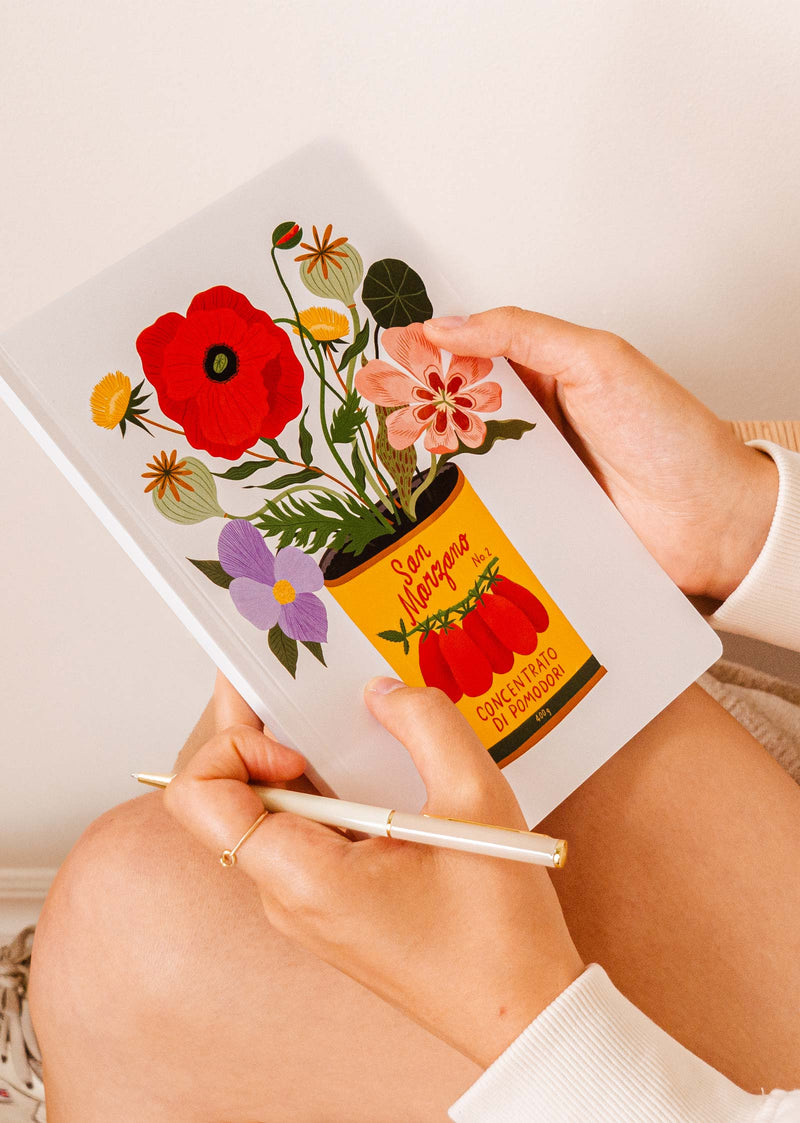  illustrated notebook with an empty tomato cane overflowing with flowers  by Bodil Jane x Mimi and august