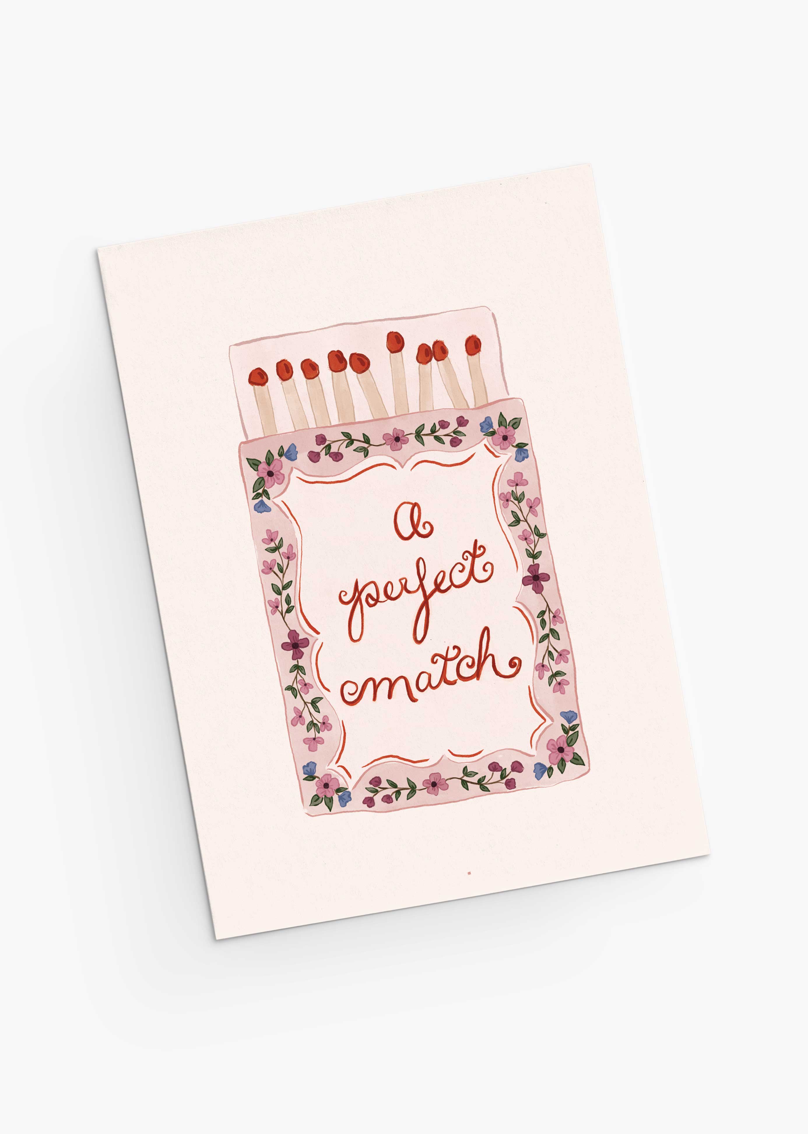 The Perfect Match Greeting Card by Mimi & August features a matchbox and floral border with "A perfect match." Printed on recycled paper, it’s an eco-friendly way to share heartfelt Valentine's Day wishes.