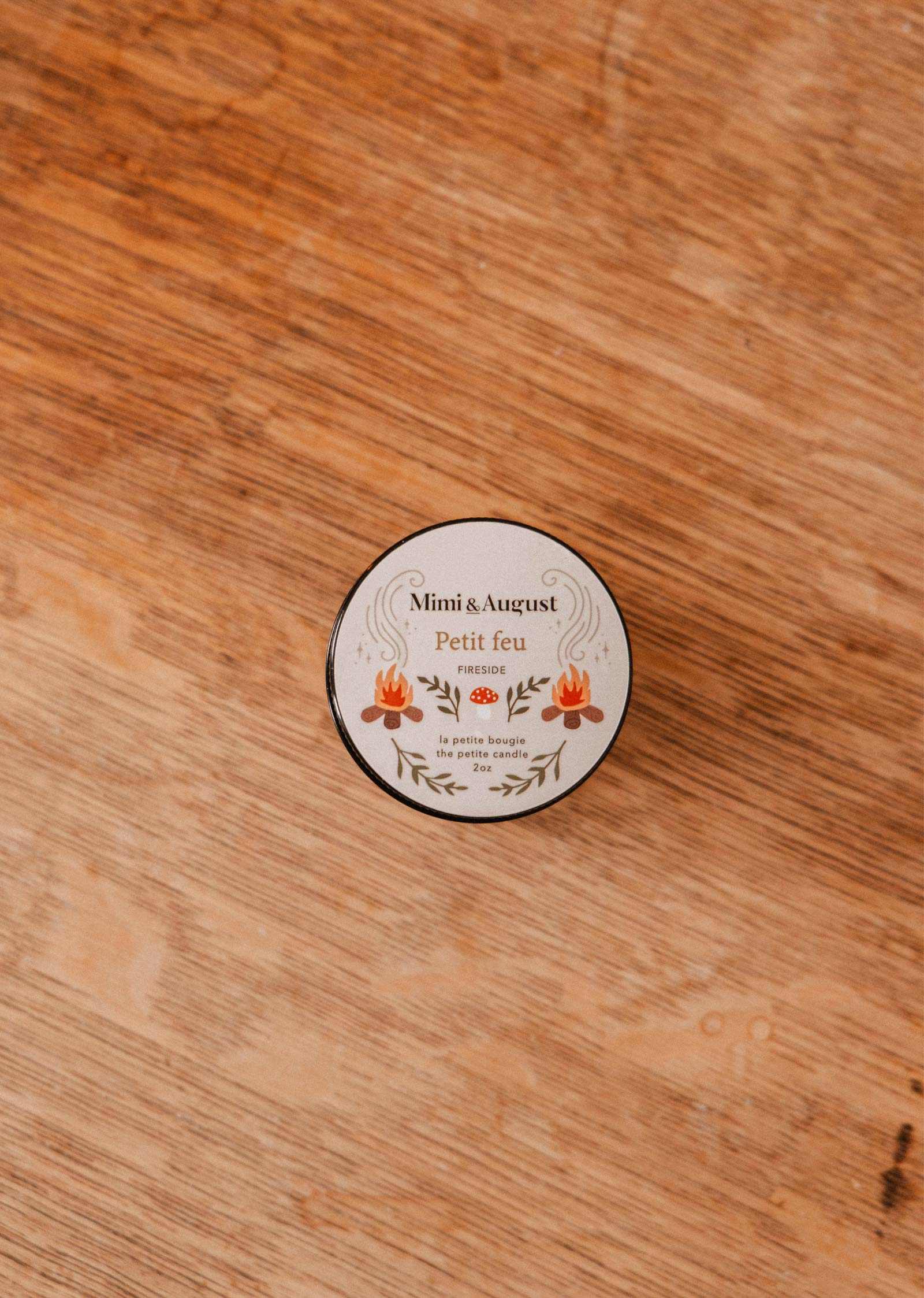 The Mimi & August Petit Feu – 2 oz Soy Candle features a floral tin, coffee scent, and reusable design—perfect for any space.