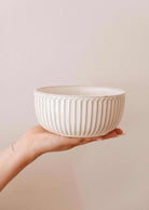 Ribbed ceramic bowl by Mimi & August, round handmade design with cream glaze