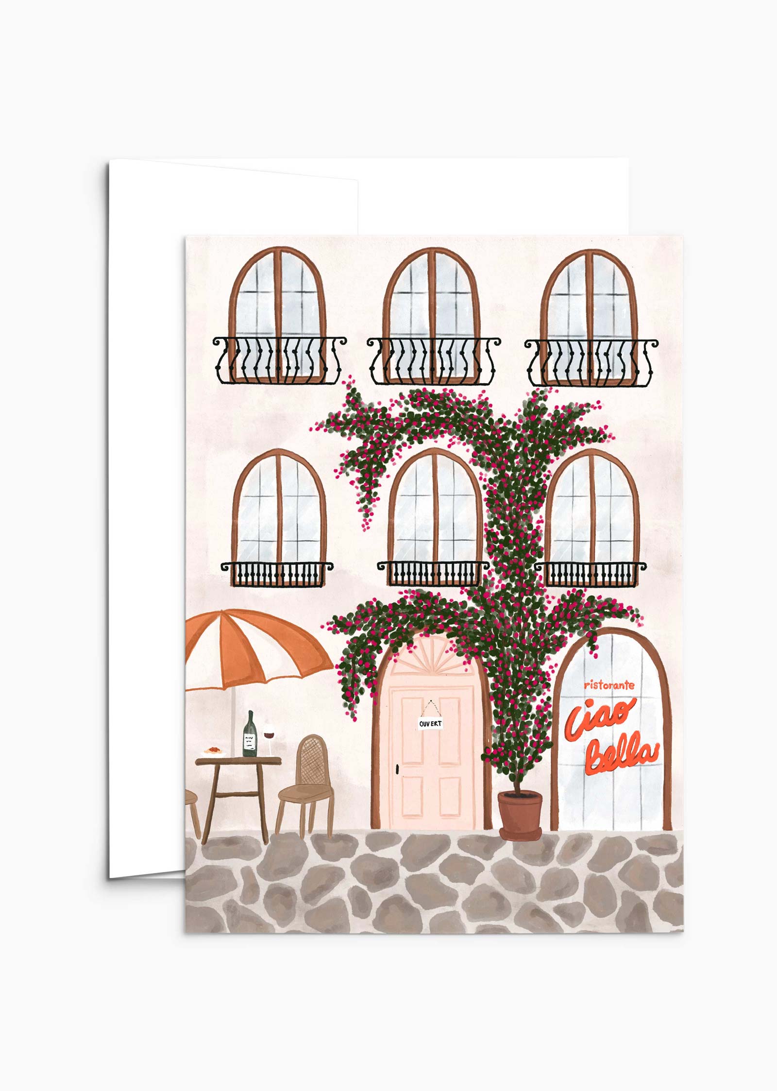 The Ristorante Greeting Card by Mimi & August depicts a charming Italian building with five arched windows, a café table with an umbrella, and a vine-covered door labeled "Ciao Bella," all crafted on recycled paper, capturing the whimsical essence of a quaint Italian corner.