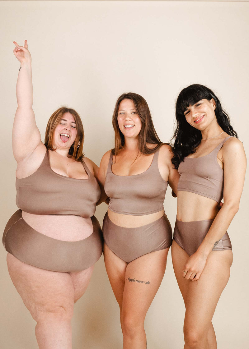 Three women posing for a photo in mimi and august's Dunes Bralette Bikini Top.