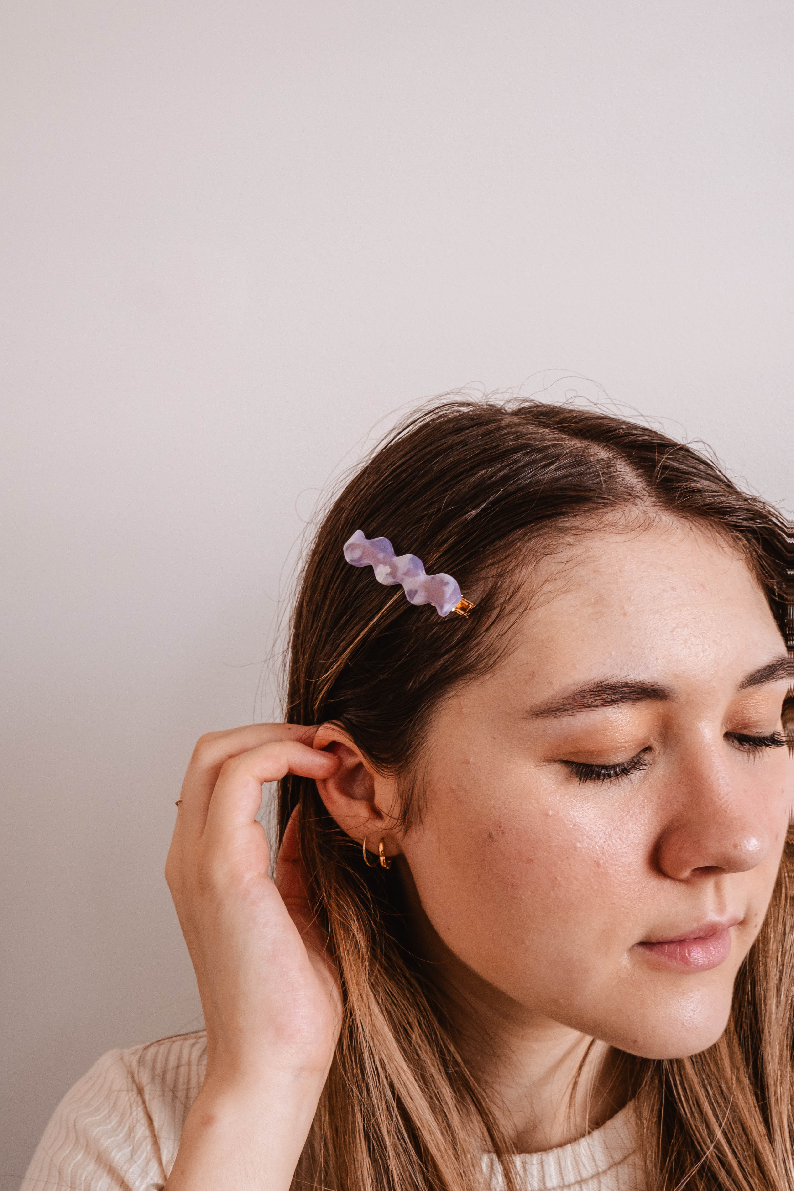 Amethyst Hair Clip by Mimi & August, cute light purple with gold colors wearing by a woman