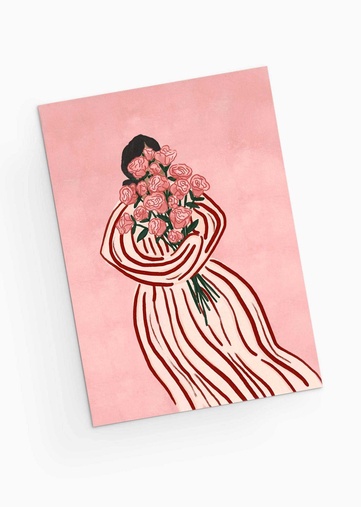 A person in a striped dress holds a bouquet of pink roses on a matching pink background, echoing the elegance and charm of the Bouquet of Roses Greeting Card by Mimi & August. Perfect for sustainable keepsakes, it features floral elegance on recycled paper.