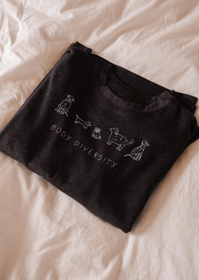 A comfortable Doggo Diversity Sweatshirt by Mimi & August with a drawing of a dog on it. Perfect for dog lovers.