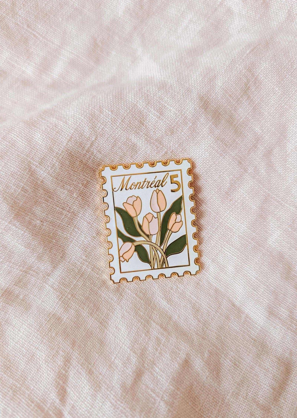 Montréal Stamp enamel pin with blooming tulips and gold tone brass design