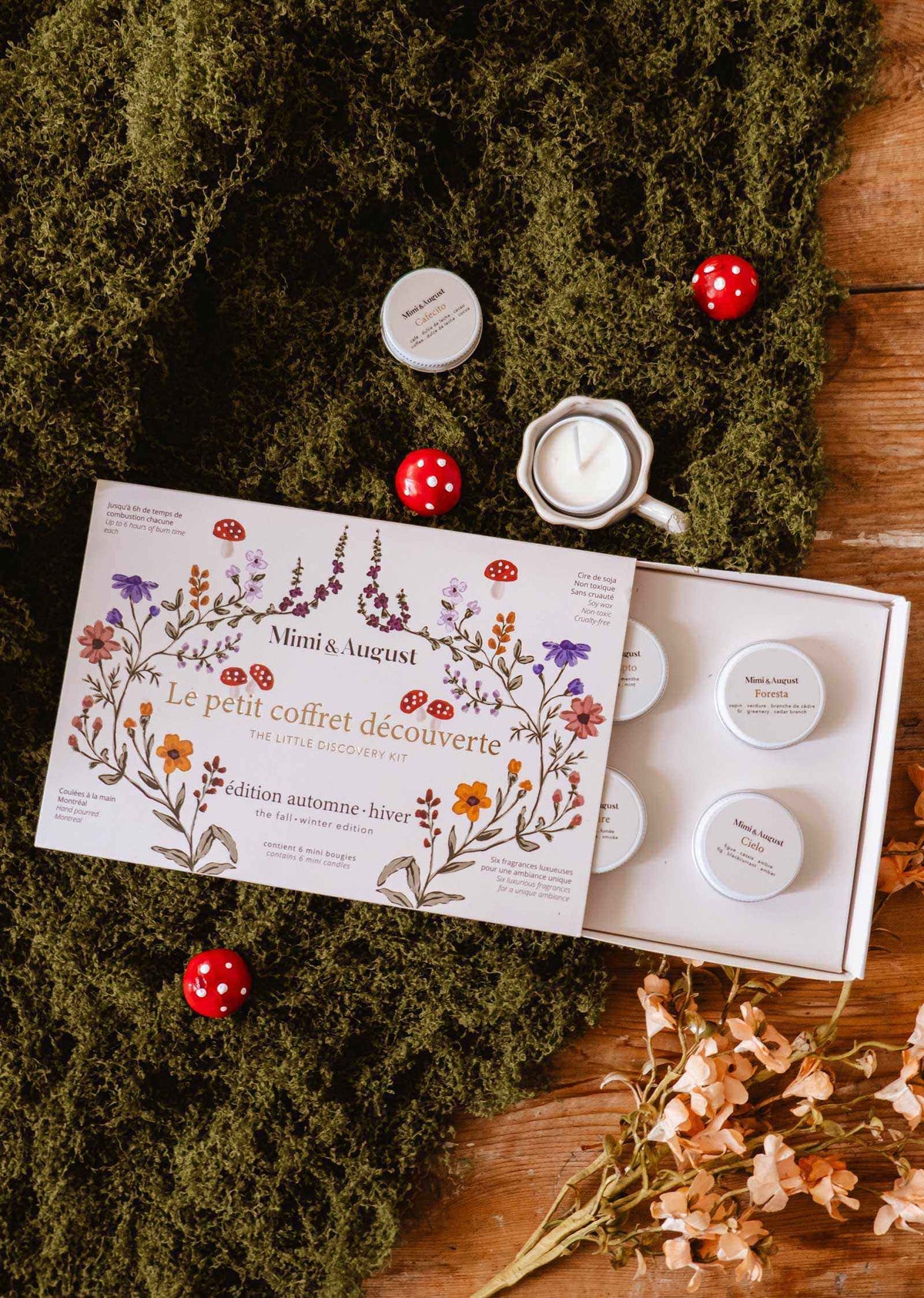 fall candle gift set with six white soy tealights in a floral illustrated discovery box