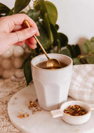 Petite gold stainless steel teaspoon named The Golden Touch, 13 cm long, lightweight and durable for elegant tea stirring