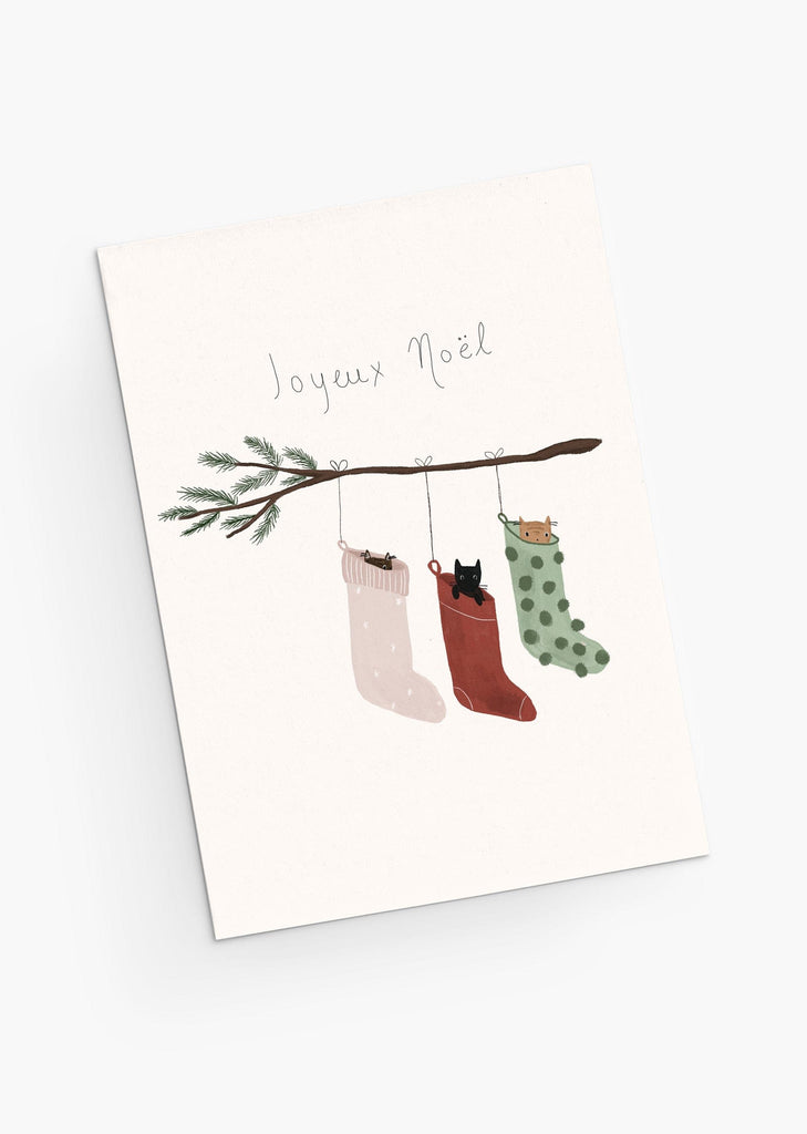 Holidays greeting cards with Christmas socks with kitties in it under a branch . By Mimi & August