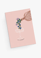 Let's Celebrate Greeting Card with whimsical bouquet flowing into a coupe glass on soft pink background