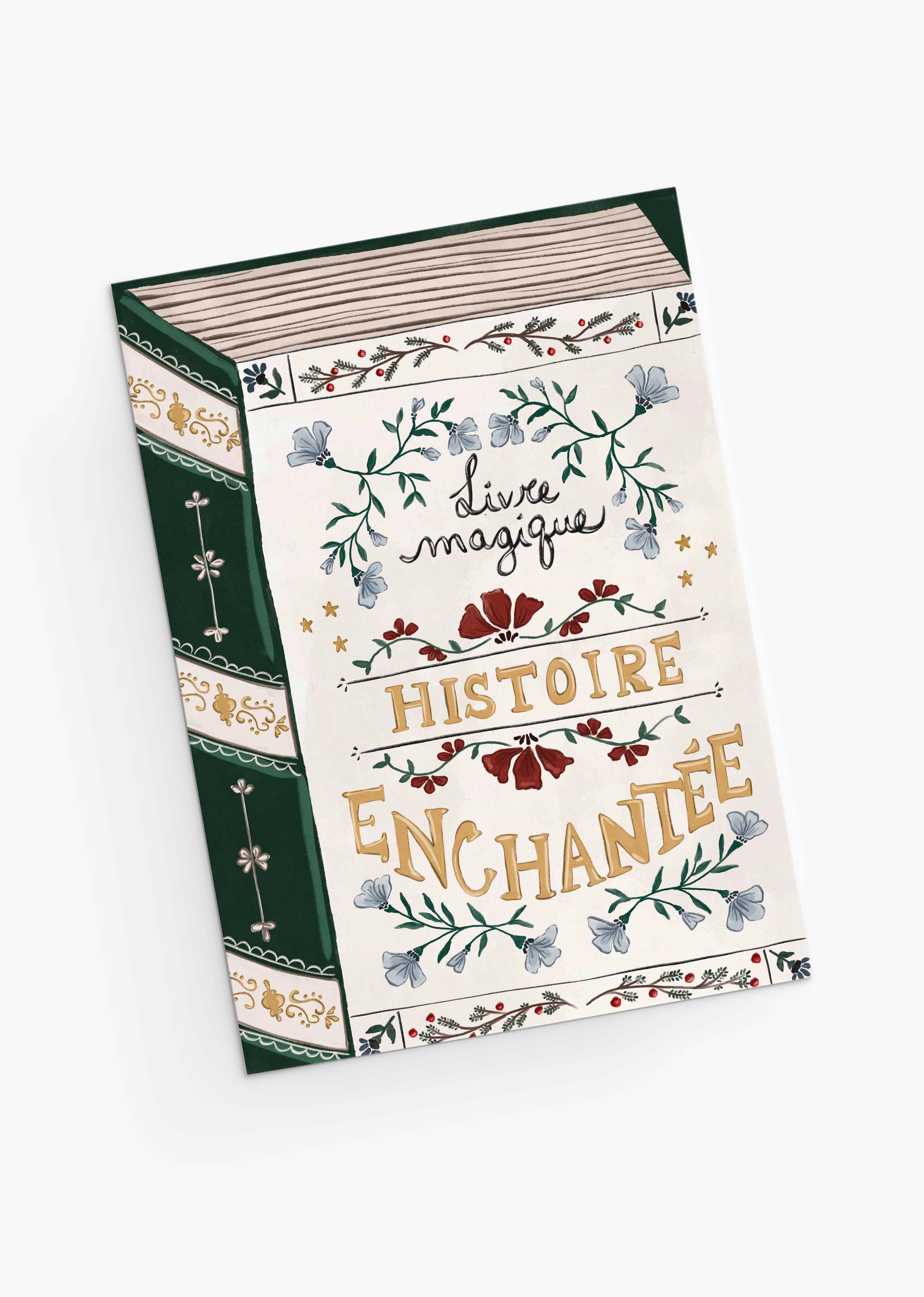 An eco-friendly Christmas greeting card by Mimi & August, "Enchanted Book," features ornate floral designs and decorative gold and black lettering on the cover, printed on recycled paper.