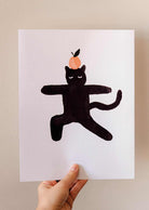 Orange Black Cat Art Print featuring a curious feline with bright orange on head, high-quality full-color recycled paper print.