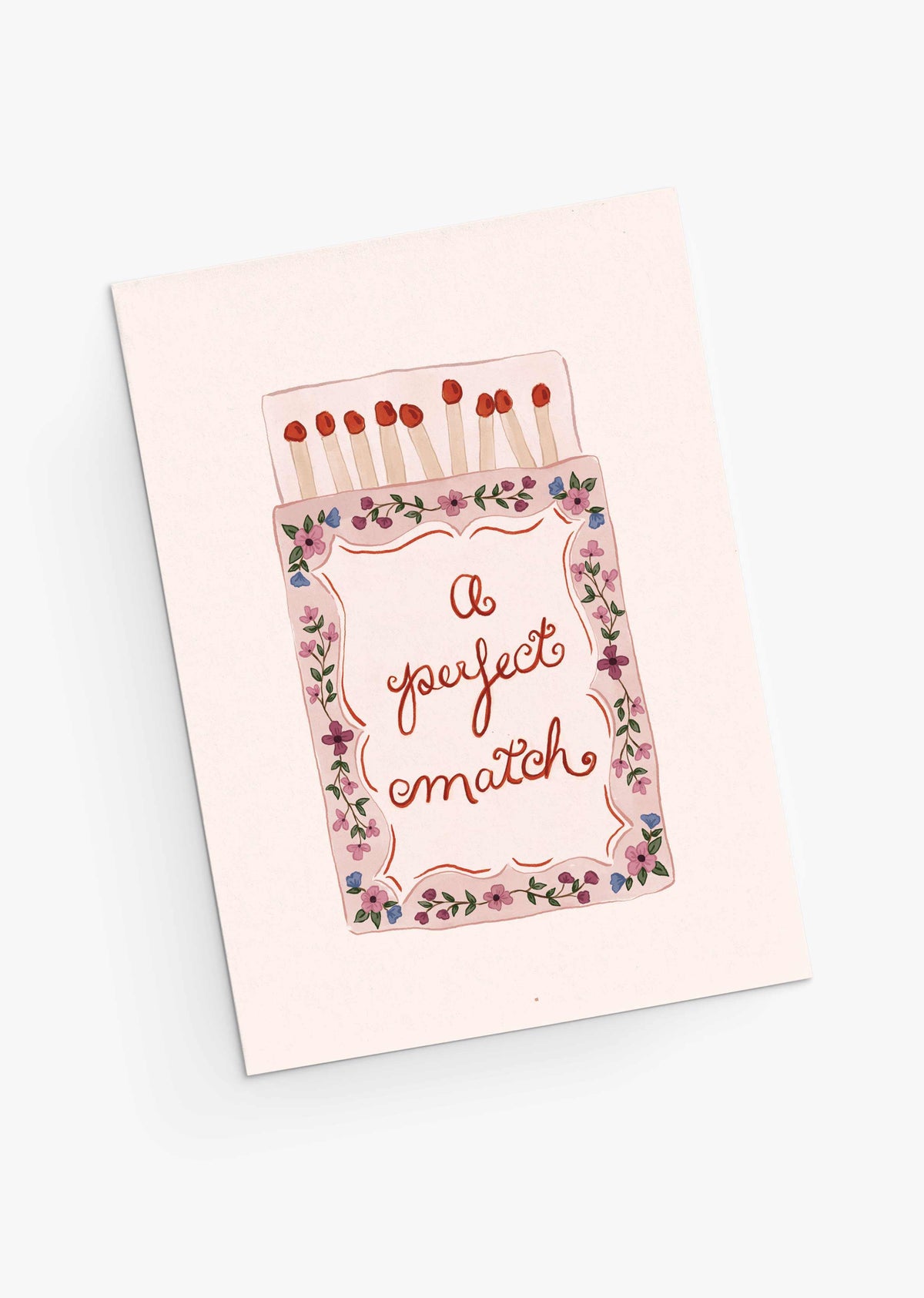 The Perfect Match Greeting Card by Mimi & August features a matchbox and floral border with "A perfect match." Printed on recycled paper, it’s an eco-friendly way to share heartfelt Valentine's Day wishes.