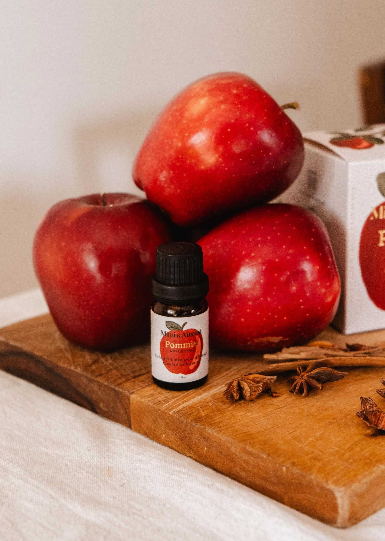 Bottle of apple cinnamon scented oil for diffusers with autumn-inspired aroma