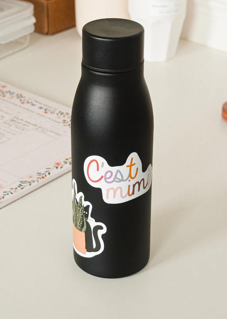 black water bottle with c'est mimi sticker
