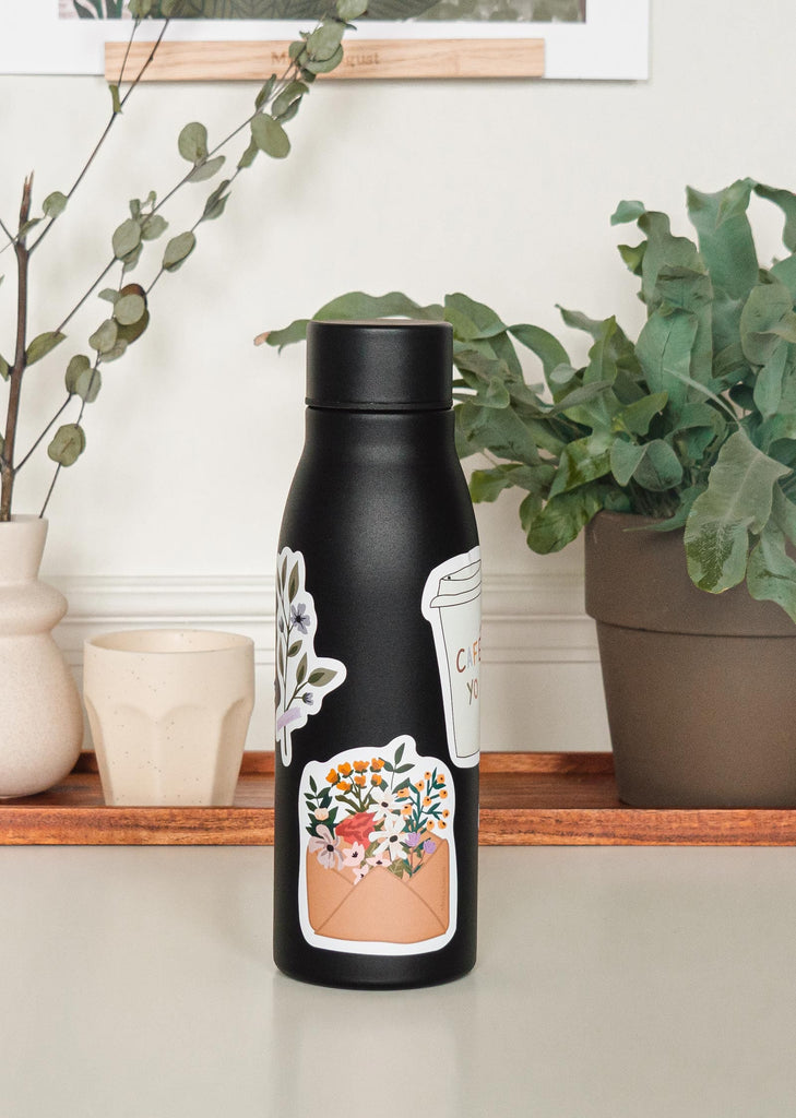 black water bottle with colorful floral sticker
