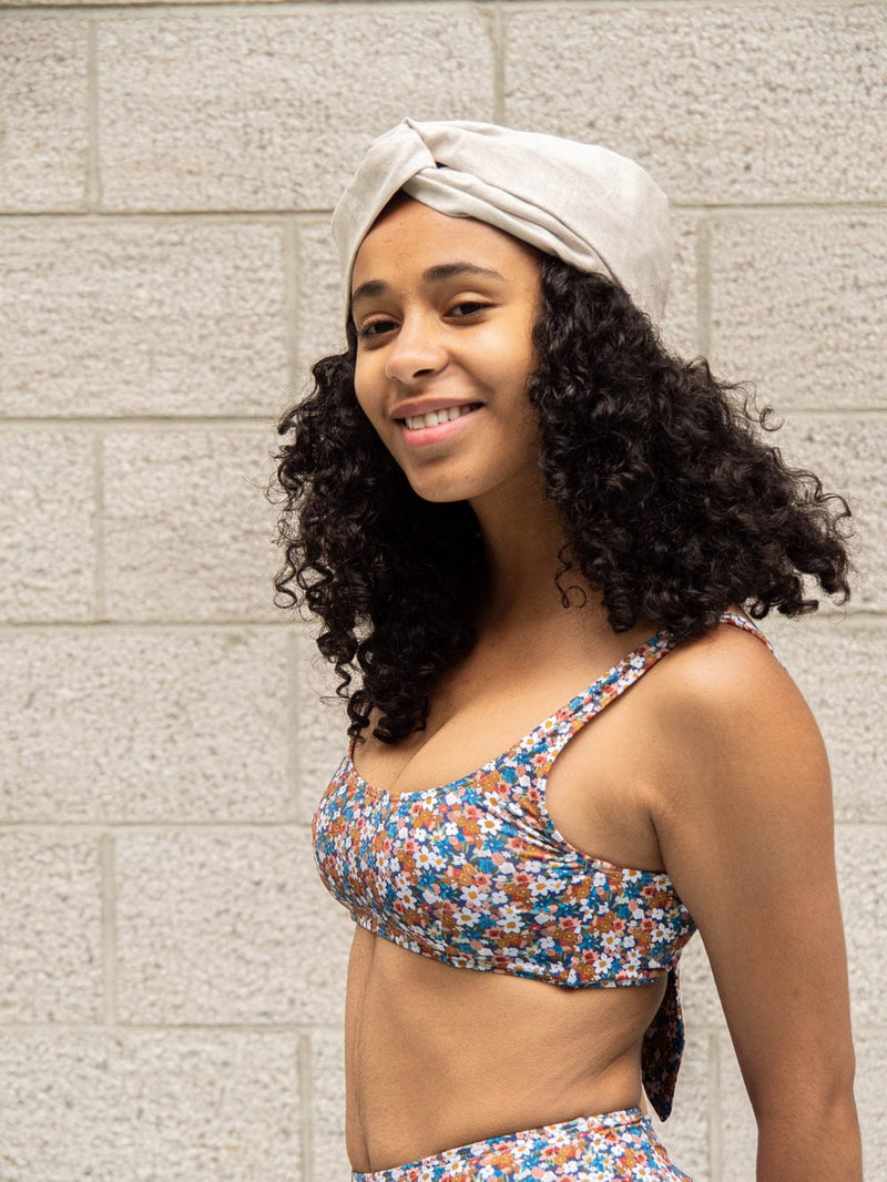 Iklas is wearing the floral bouquet Lima size Sbralette bikini top by Mimi and August 