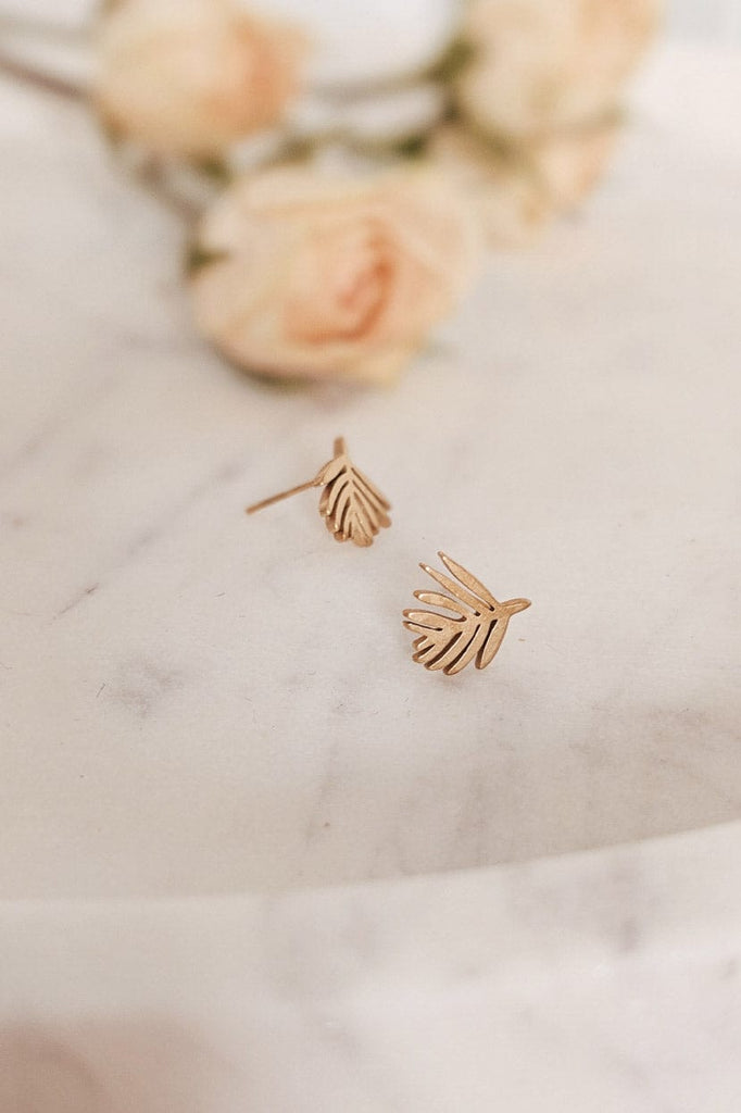 A pair of Palm Leaf - Gold Earrings by Mimi & August.