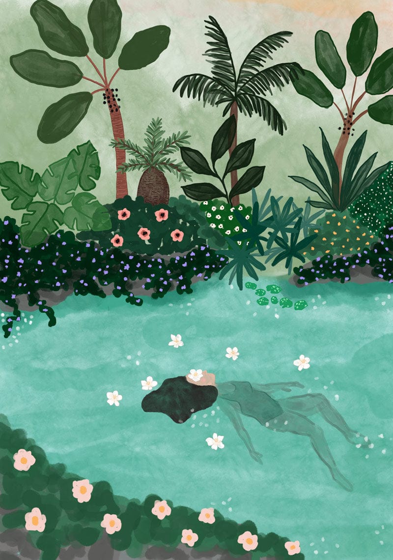 A person floats in a serene pool surrounded by lush tropical plants and flowers, with eco-friendly "Swimming in the Amazon Art Print" by Mimi & August featuring pink and white blossoms scattered on the water's surface.