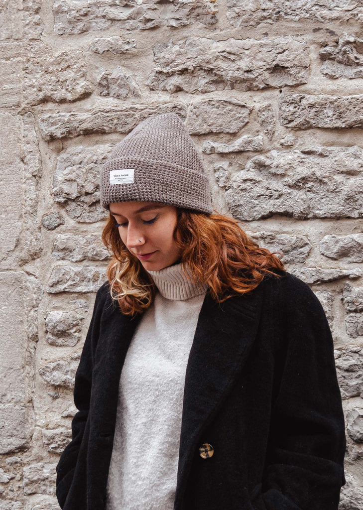 woman wearing the brown waffle beanie