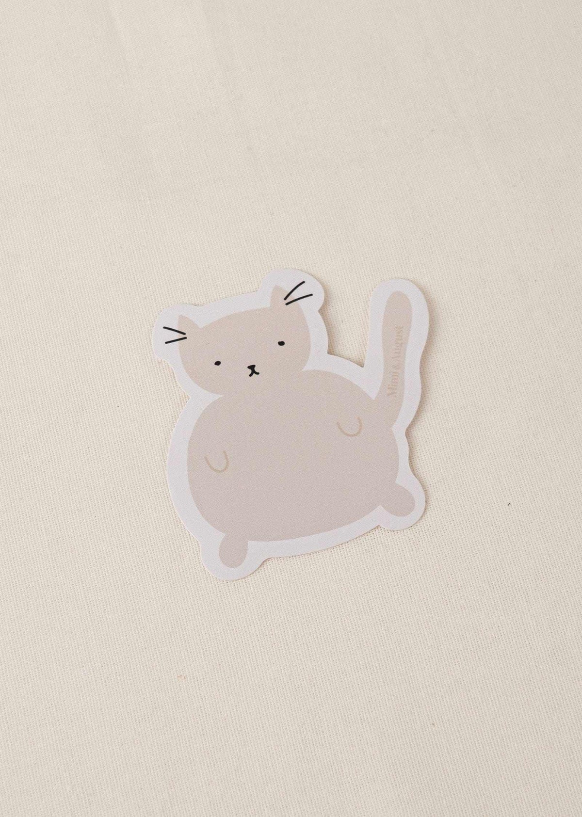 Charlotte vinyl sticker featuring a cute cat illustration with a white border on a beige background