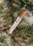 Foresta forest room spray with wooden cap on fir tree branches for a fresh, grounding scent