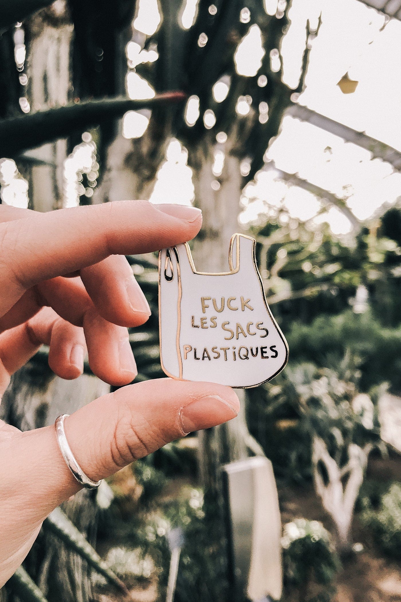 Fuck les sacs plastiques is the statement enamel pin by mimi & august