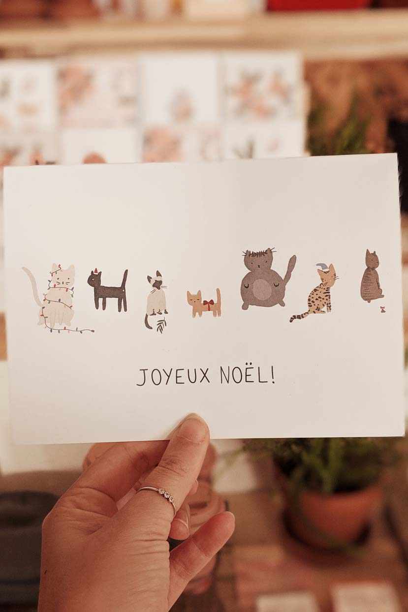 Joyeux Noël greeting card featuring illustrated cats on thick matte recycled paper with blank inside and white envelope.