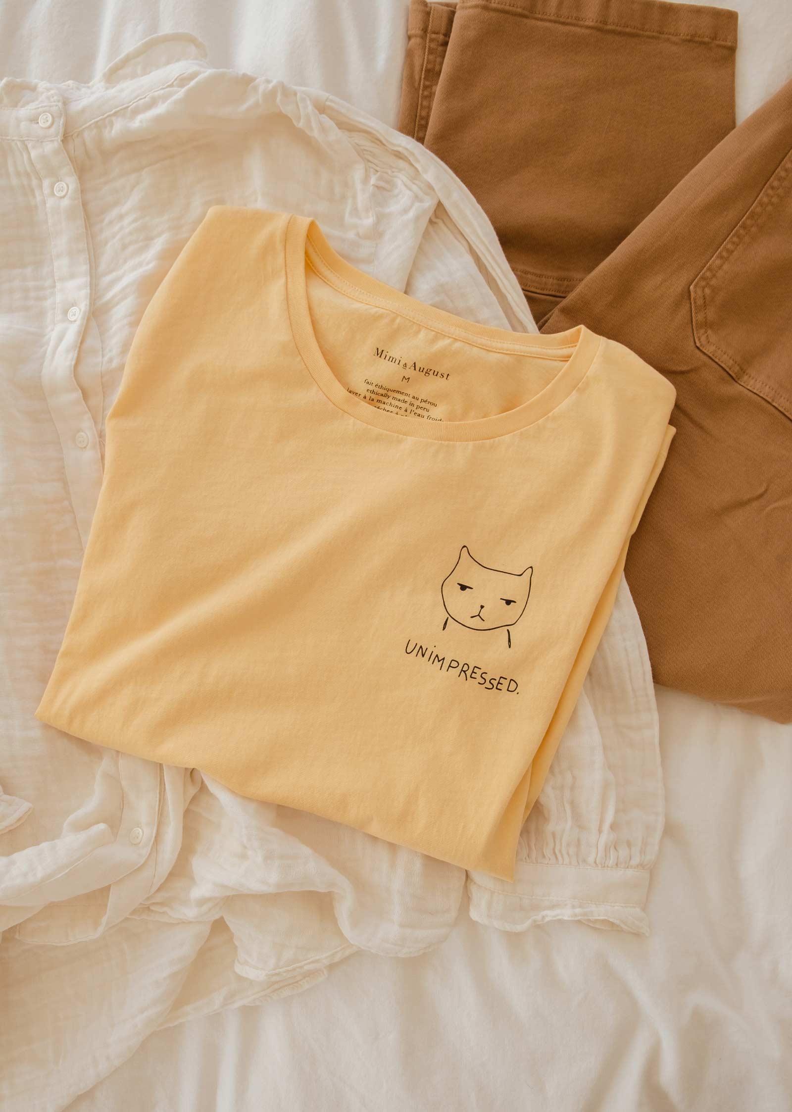 unimpressed cat illustration t-shirt made by mimi and august