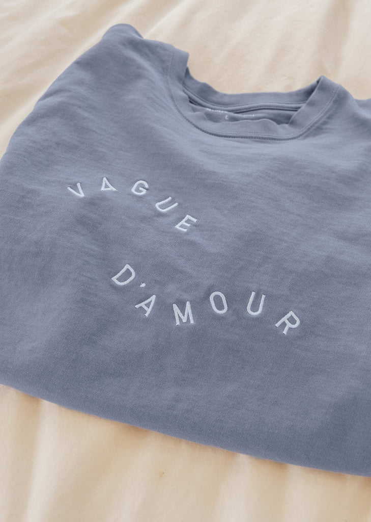 Sweater made of pima cotton by Mimi and August with a phrase embroidered in white that says Vague d'amour