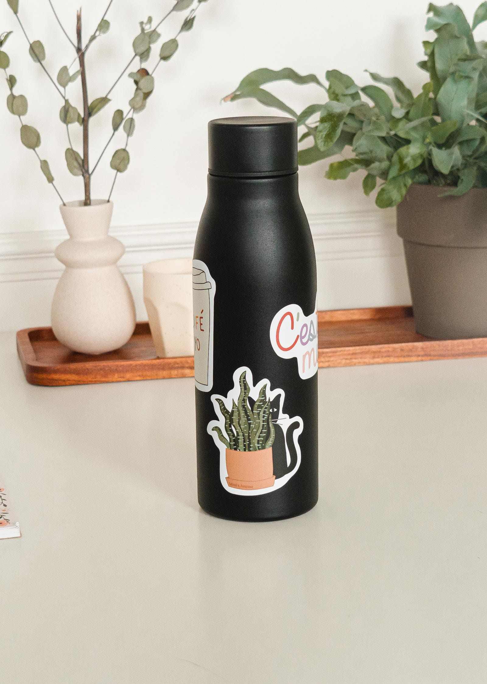 mimi and august sticker in water bottle